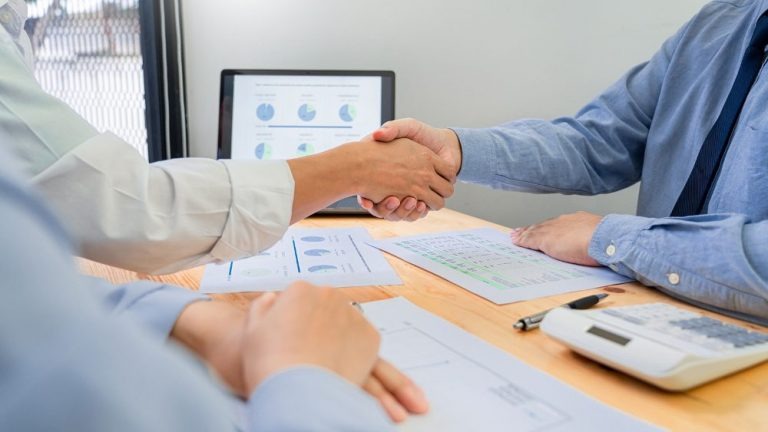 Shaking hands with an RV Finance manager
