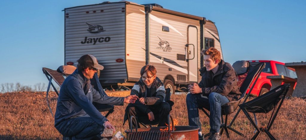 Dad and 2 sons outside Jayco Jay Flight SLX