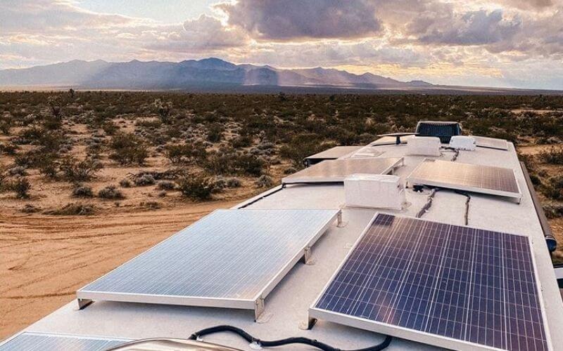 solar panels on top of RV in the mountains