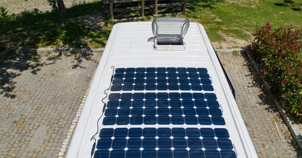 top of an rv with row of solar panels