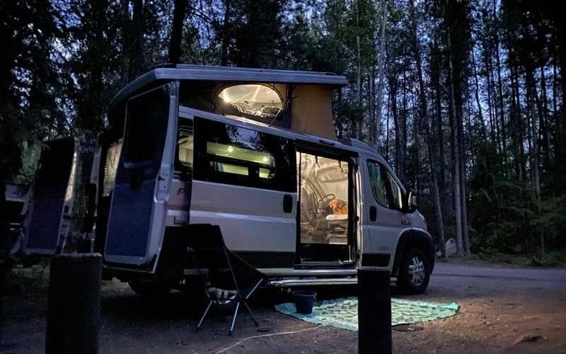 camper van at night with lights on