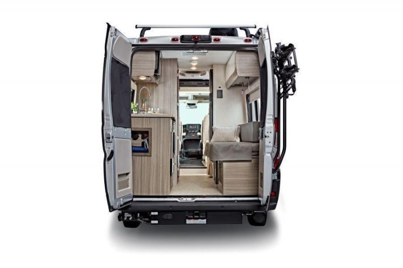 camper van with rear doors open, showing interior