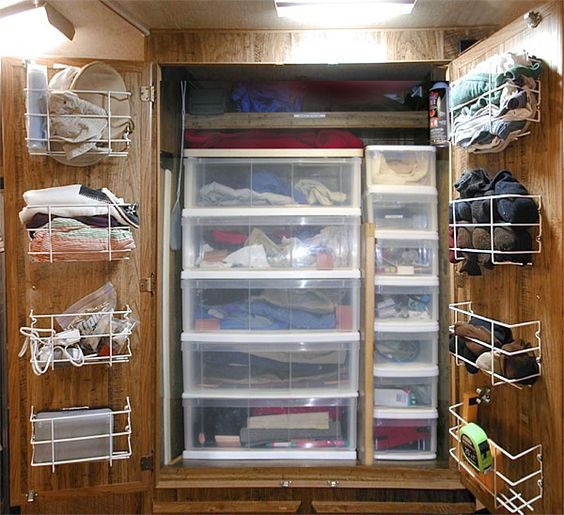 RV closet with bins and hanging storage racks