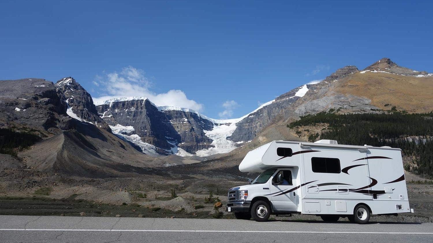 class c driving through snow covered mountains