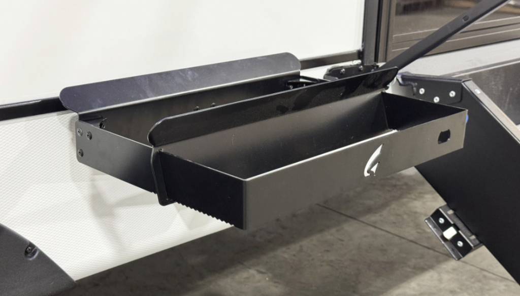 
This image showcases a fold-out exterior storage tray, which adds functionality and convenience to the RV. Perfect for holding grilling tools, small camping gear, or other outdoor essentials, this tray provides easy access while saving interior storage space. It reflects the practical design approach aimed at enhancing the outdoor experience for RV travelers.