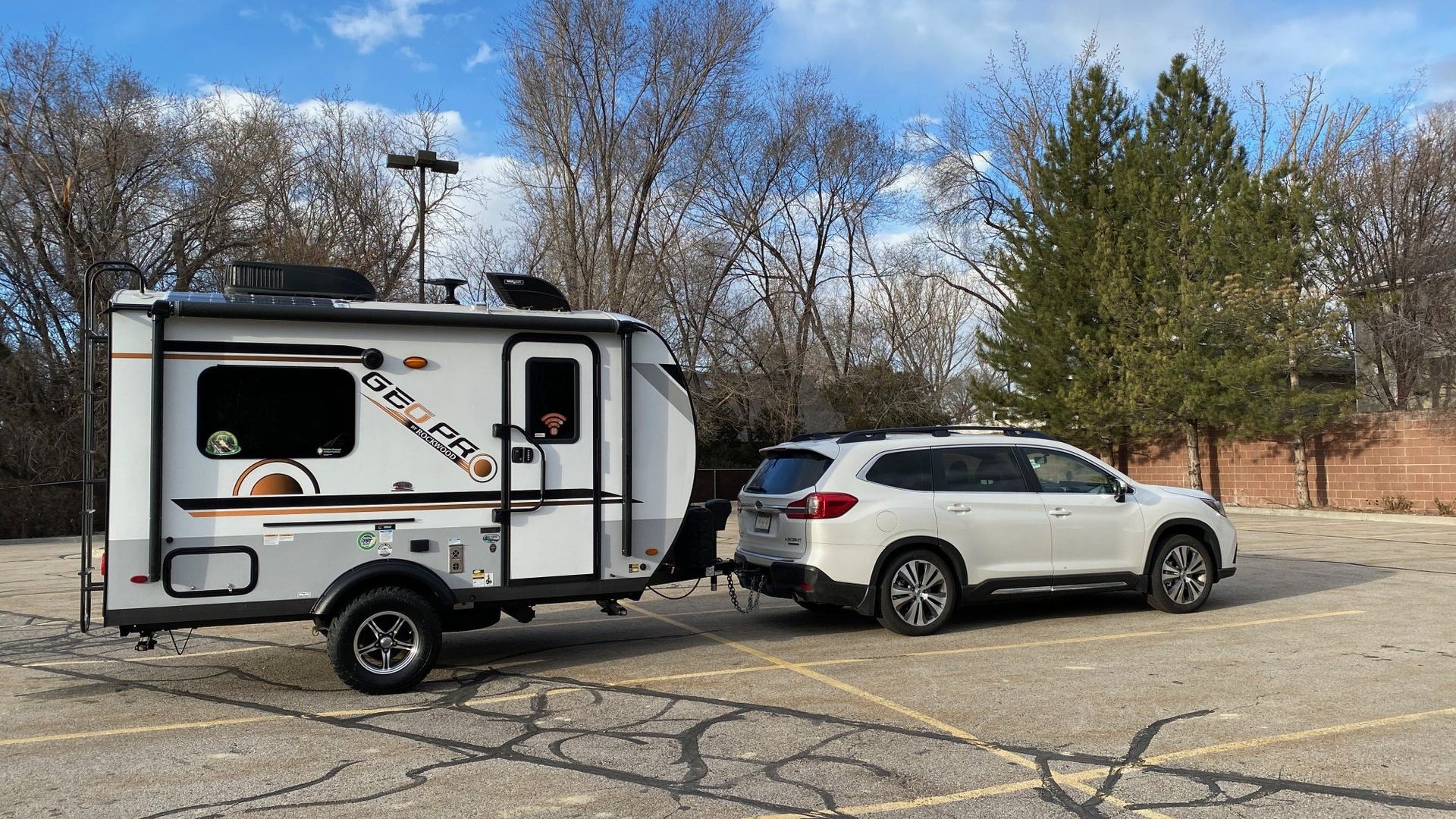 small suv towing a Geo Pro RV